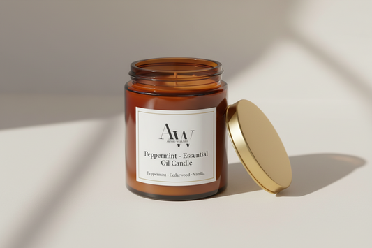 Peppermint essential oil candle in an amber glass jar with a gold lid, featuring a minimalist Aromu label