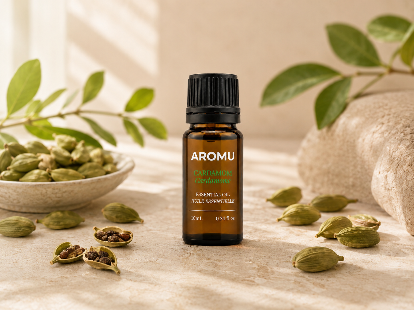 Cardamom essential oil with green cardamom pods