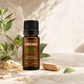 Ho Wood Essential Oil with natural wood and green leaves