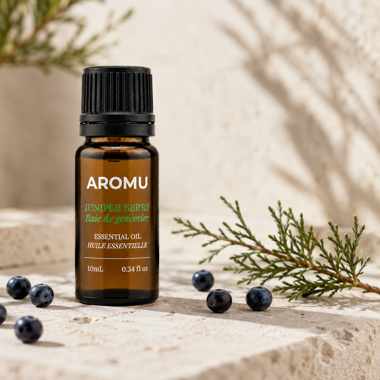 Juniper Berry Essential Oil with natural juniper berries and foliage