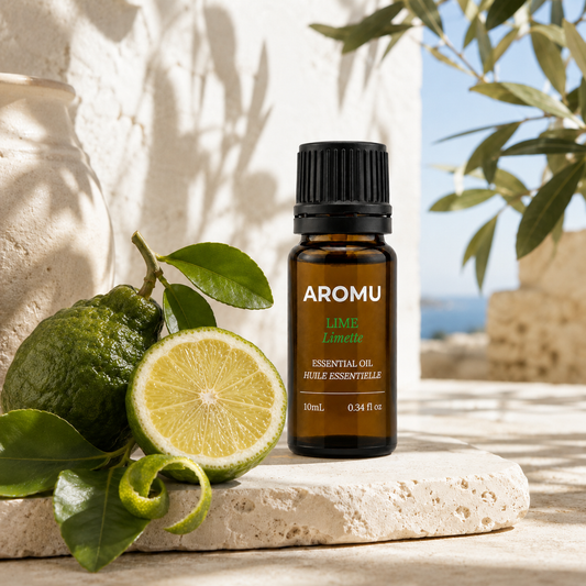 AROMU Lime Essential Oil with fresh lime and citrus leaves