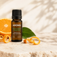 Sweet Orange Essential Oil with fresh orange and citrus leaves