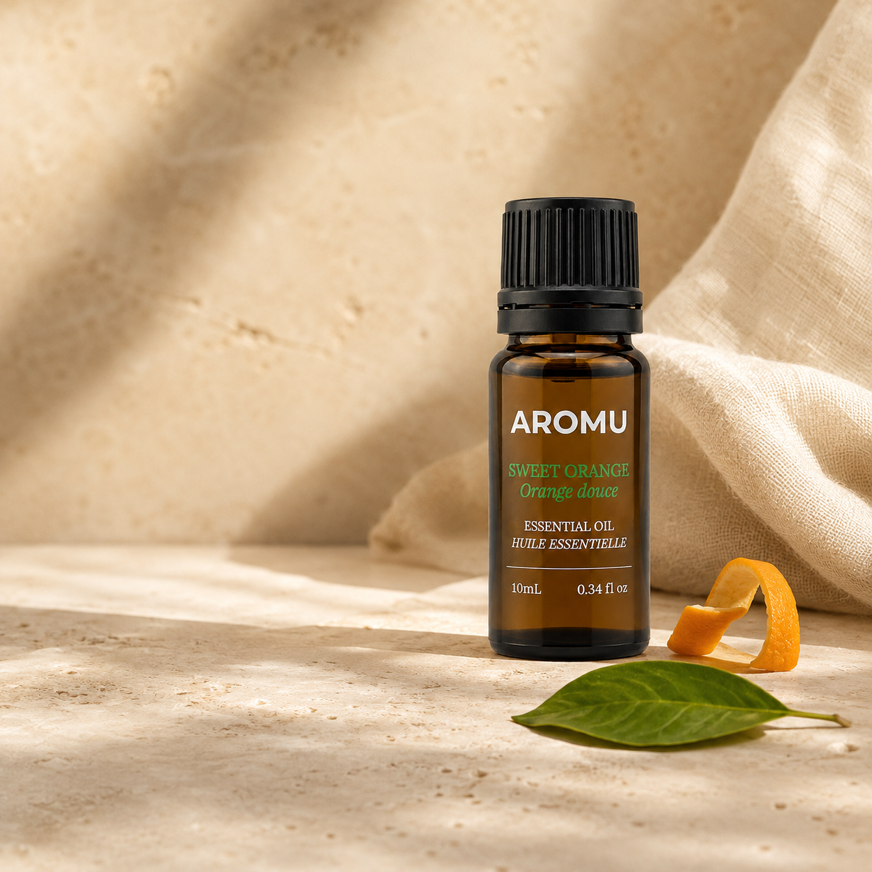 AROMU Sweet Orange Essential Oil in warm natural light