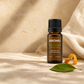 AROMU Sweet Orange Essential Oil in warm natural light